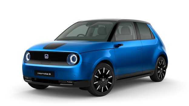 Premium crystal blue metallic Honda e Side facing three quarter.