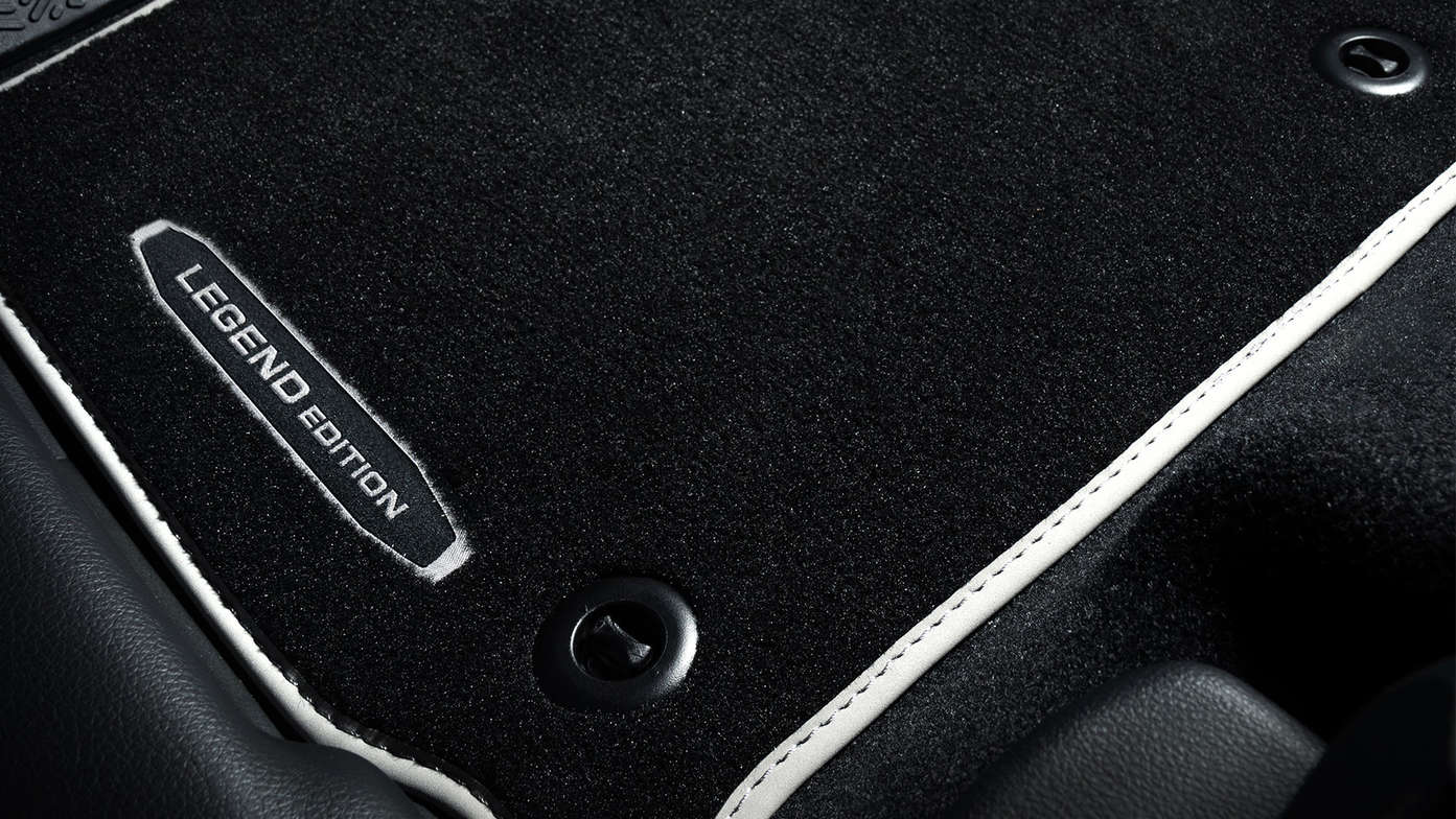 Close up Honda HR-V Legend floor mats with logo.