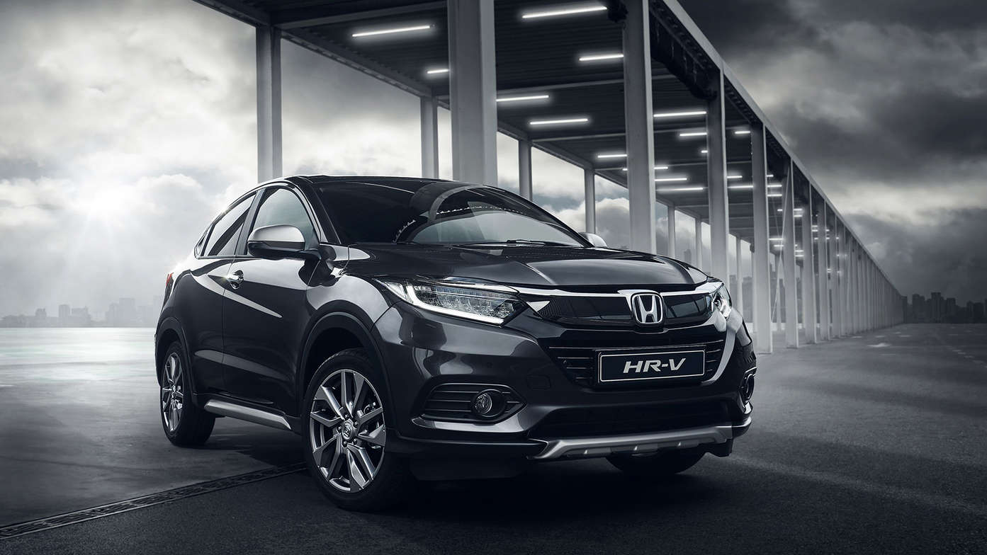 Right three quarters front view of Honda HR-V under metalic sturcture.