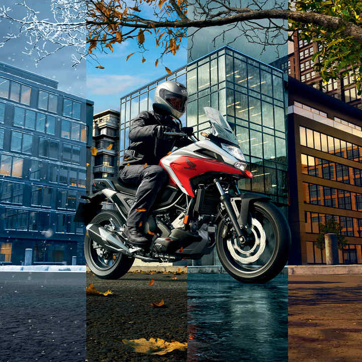 Honda NC750X, vista anteriore di tre quarti destra, con guidatore, strada cittadina, tutte le stagioni