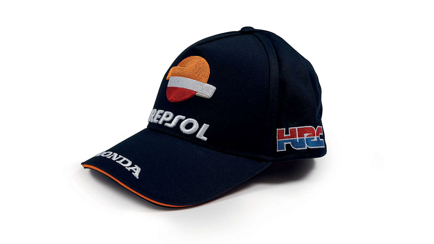 Cappellino blu Honda con i colori del team MotoGP e logo Repsol.